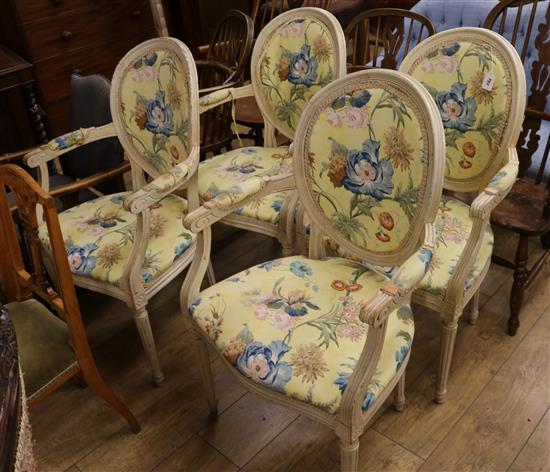 A set of four painted salon chairs